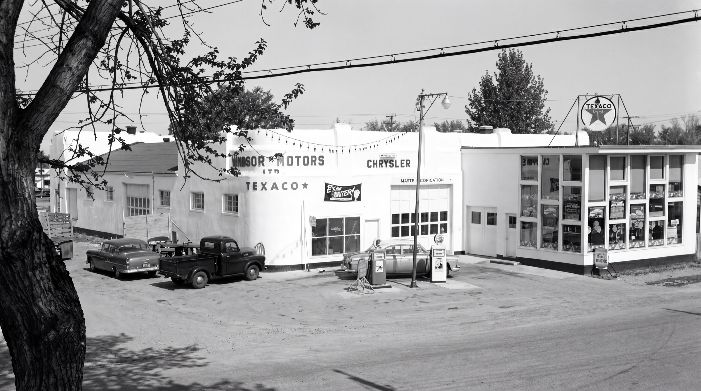 The original Windsor Motors Chrysler dealership and Texaco station in winter