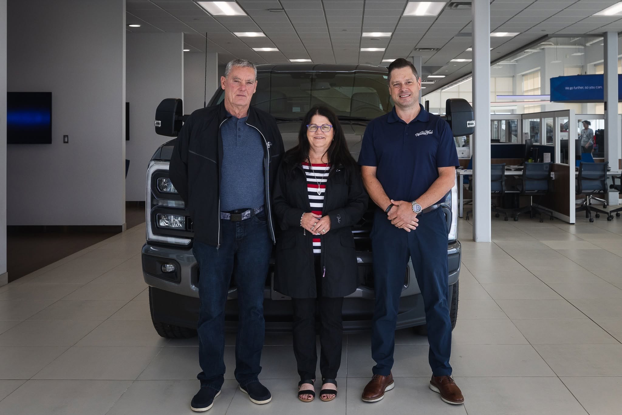 Windsor Ford team members in front of a truck in the showroom