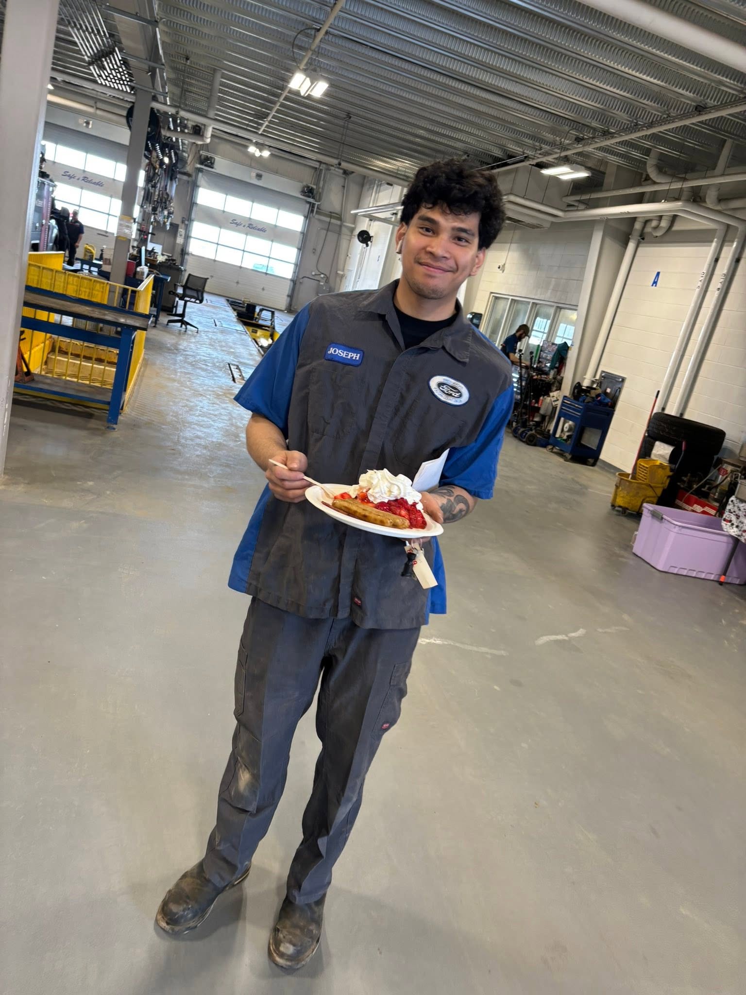 A Windsor Ford service technician enjoying a treat in the shop