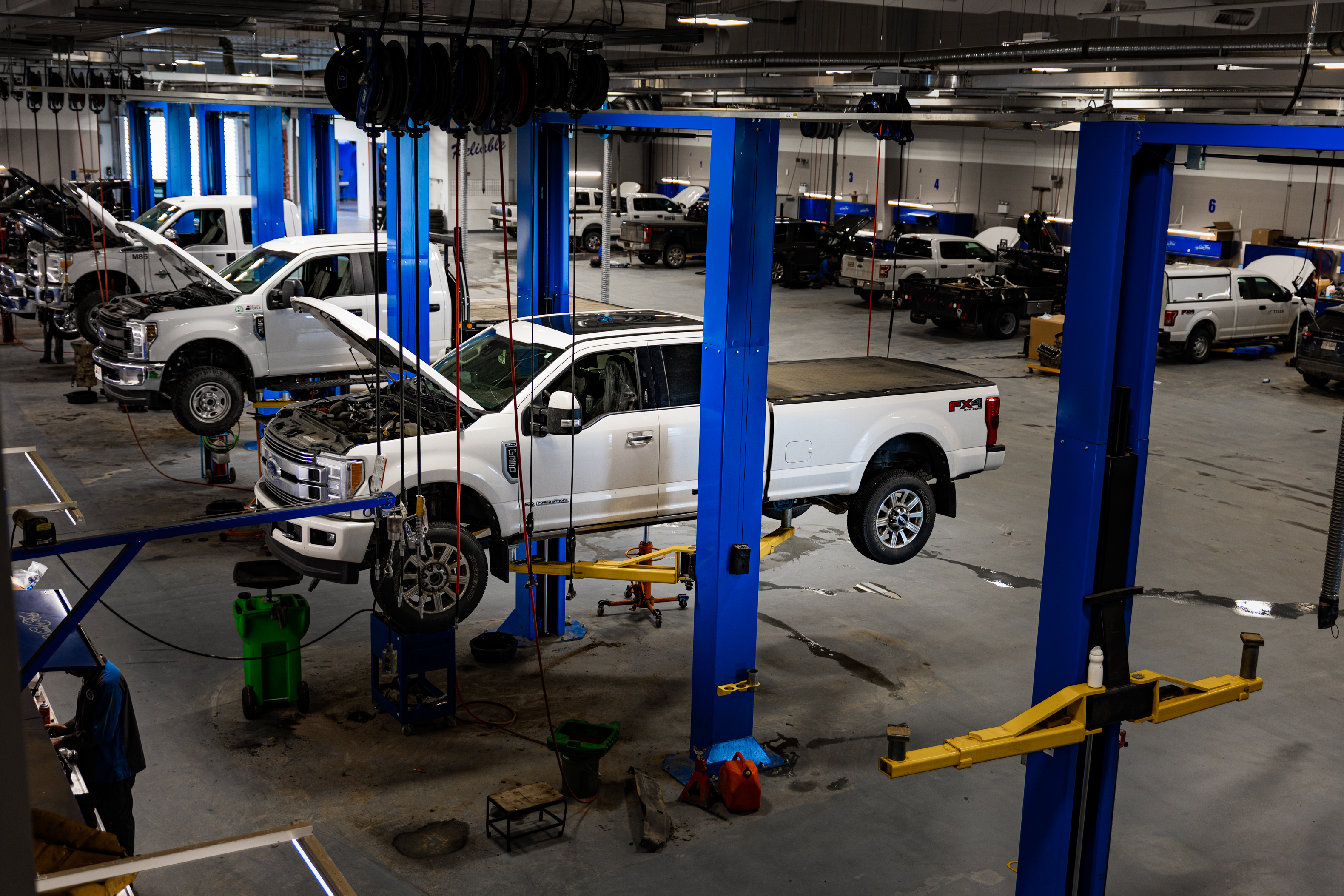 The Windsor Ford service shop floor with trucks on the hoists