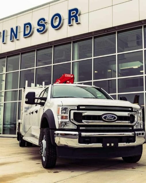 Ford F-550 with a Fassi crane and service body outside the Windsor Ford showroom