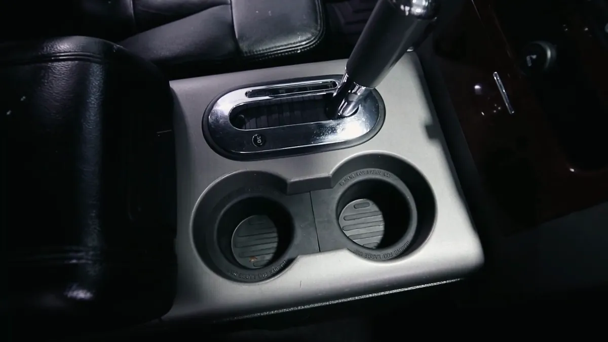 The same centre console and cup holders after detailing, cleaned out and wiped down