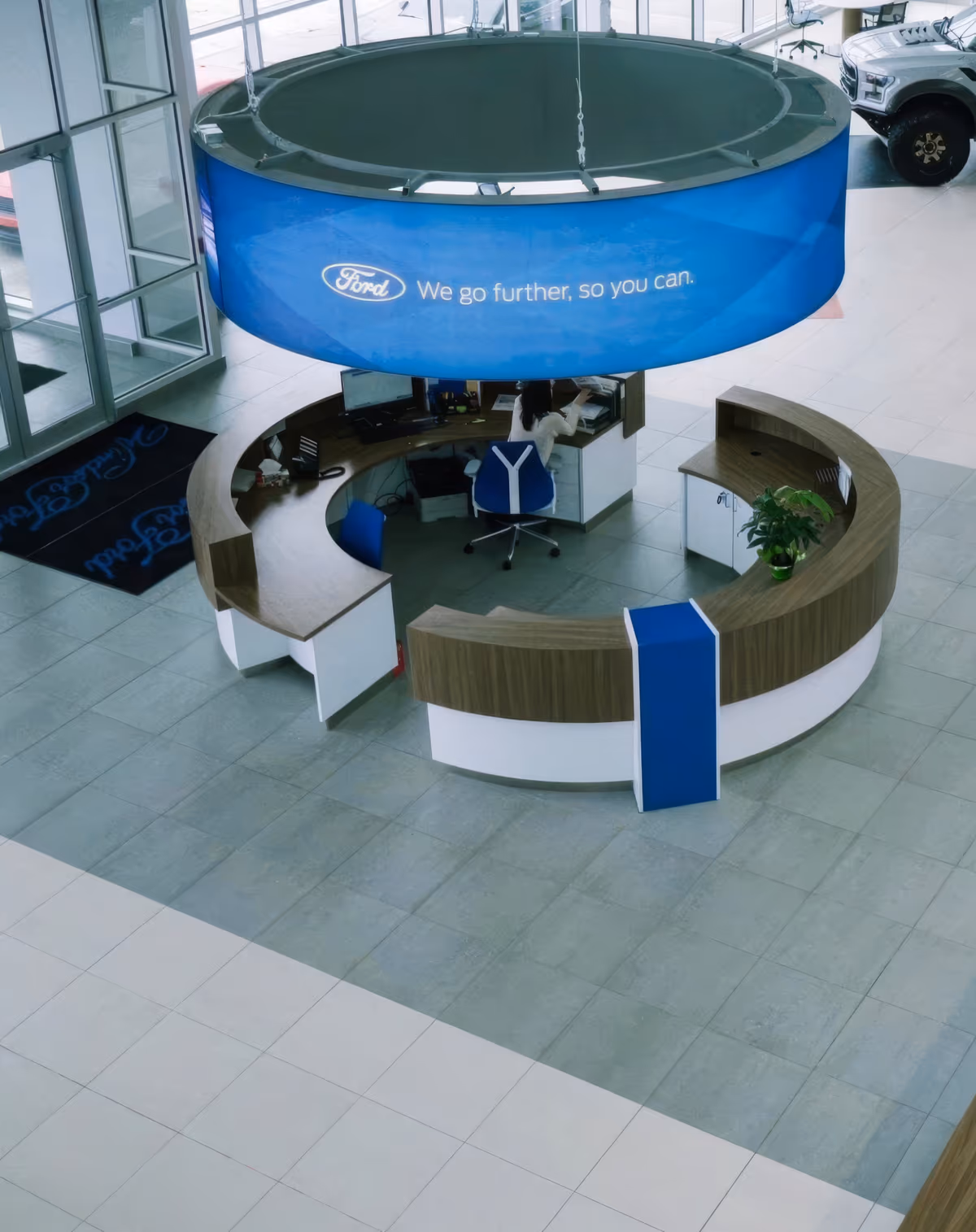 Clean dealership financing office with an F-150 visible through the window