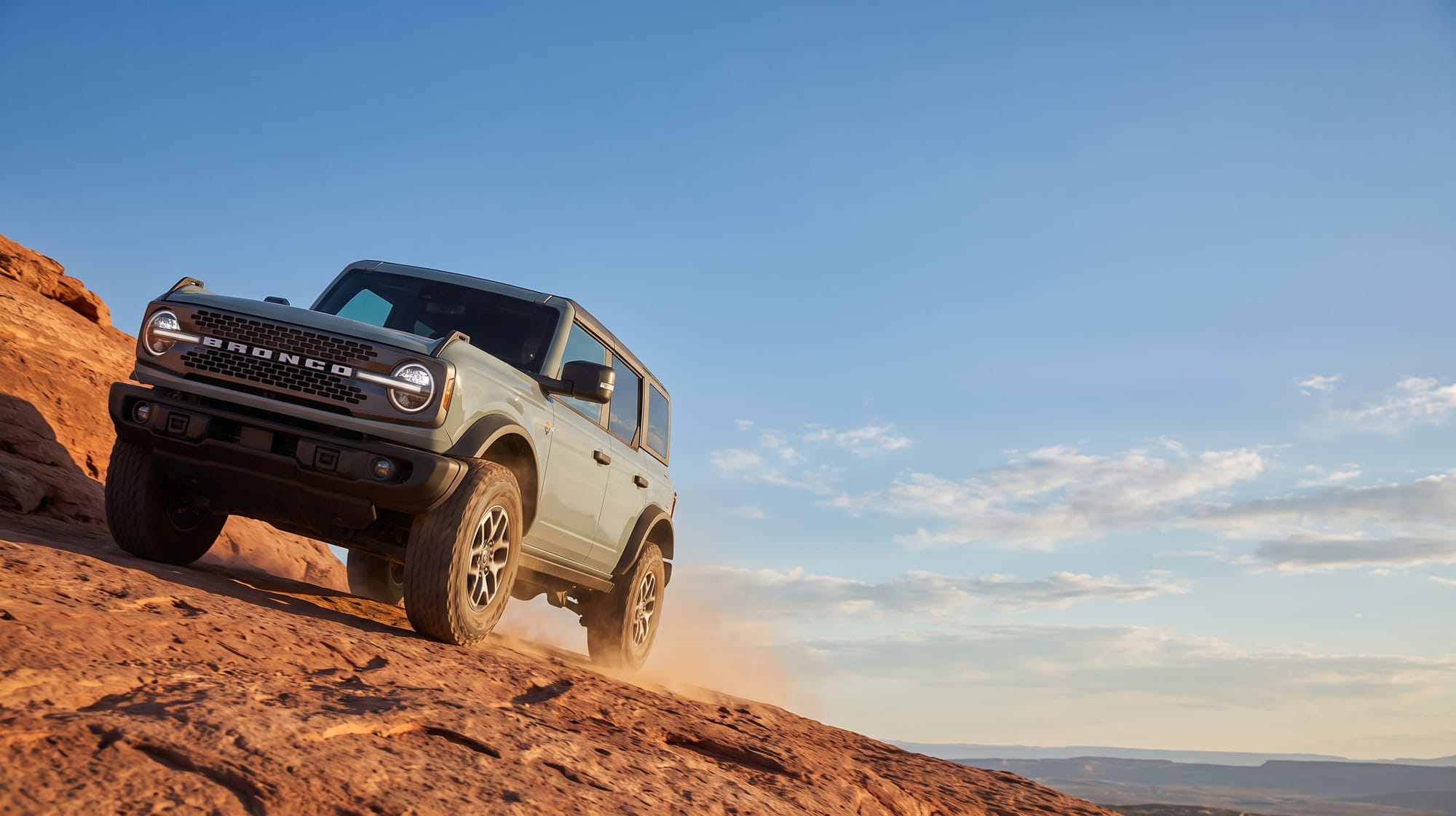 Ford Bronco climbing red rock